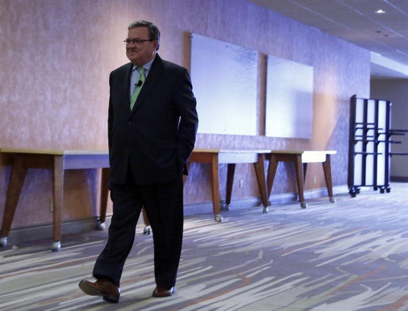 Finance Minister Jim Flaherty arrives at a post-budget breakfast in Ottawa, February 12, 2014. REUTERS/Patrick Doyle