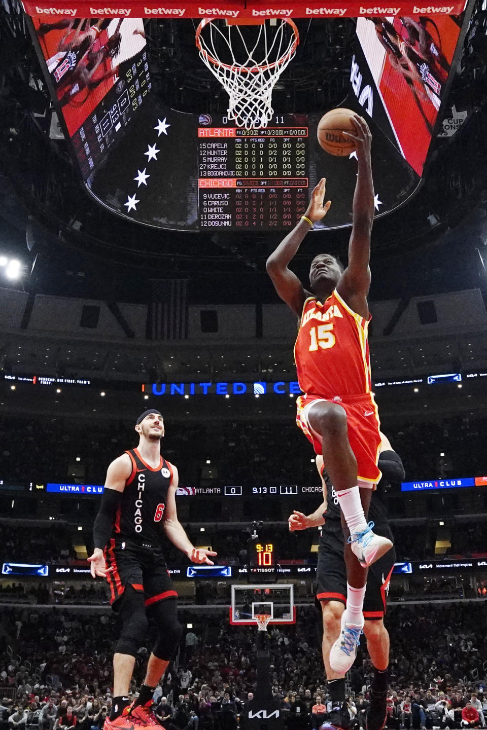 Atlanta Hawks center Clint Capela (15) drives to the basket past Chicago Bulls guard Alex Caruso during the first half of an NBA basketball game in Chicago, Monday, April 1, 2024. (AP Photo/Nam Y. Huh)