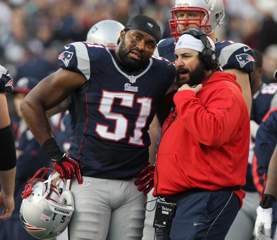 Then-Patriots defensive coordinator Matt Patricia talks with linebacker Jerod Mayo during a game in 2012.