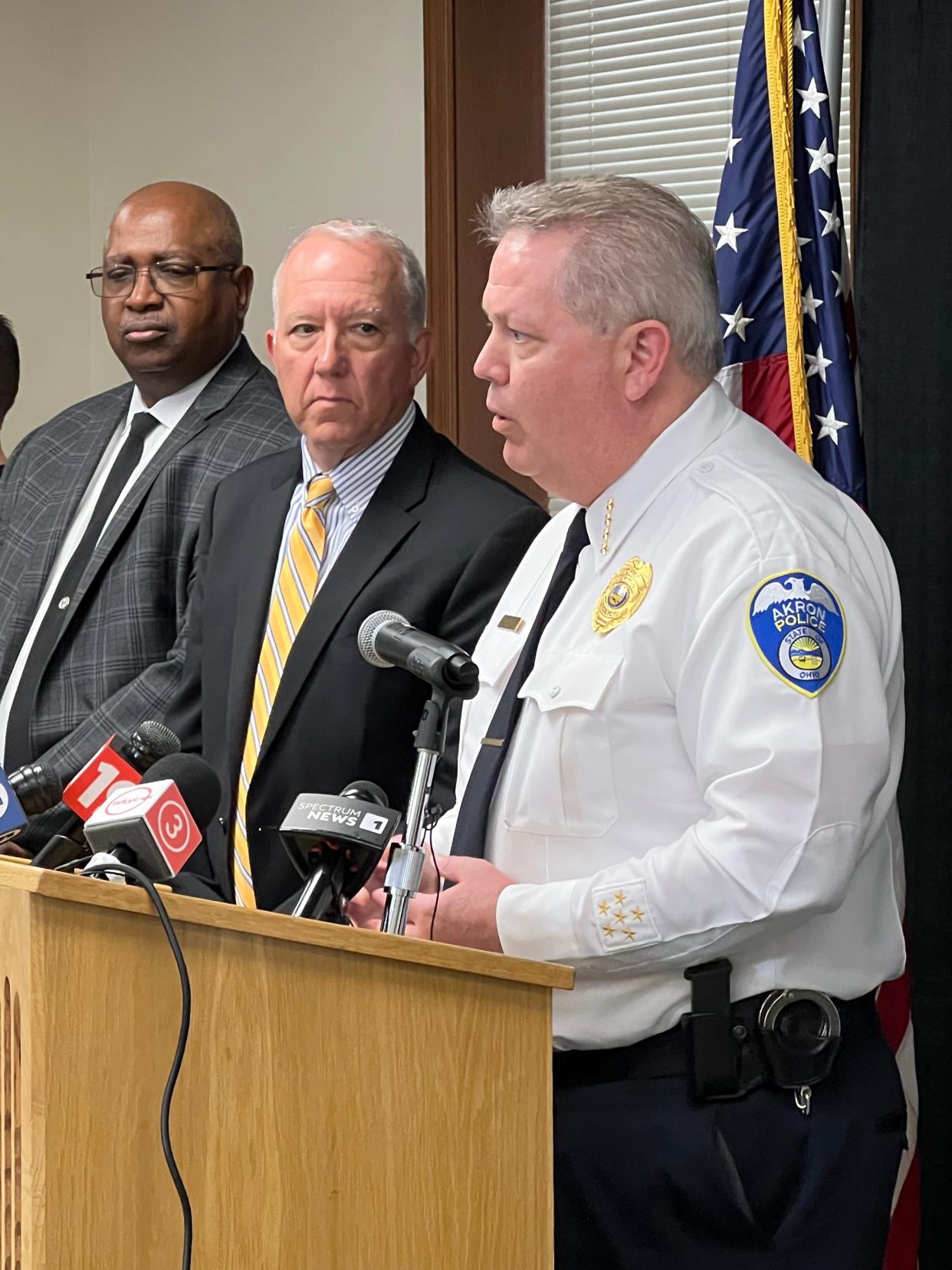 Akron, Ohio, Police Chief Steve Mylett addresses the media during a press conference in April following the grand jury decision in the Jayland Walker case as Clarence Tucker, left, deputy mayor for public safety, and Mayor Dan Horrigan listen.