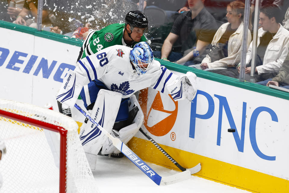 Toronto Maple Leafs goaltender Joseph Woll (60) and Dallas Stars forward Roope Hintz (24) collide during the second period of an NHL hockey game Thursday, Oct. 26, 2023, in Dallas. (AP Photo/Brandon Wade)