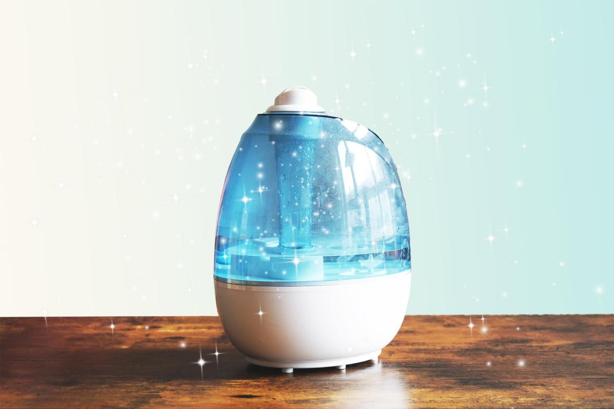humidifier sitting on a wood surface with sparkles