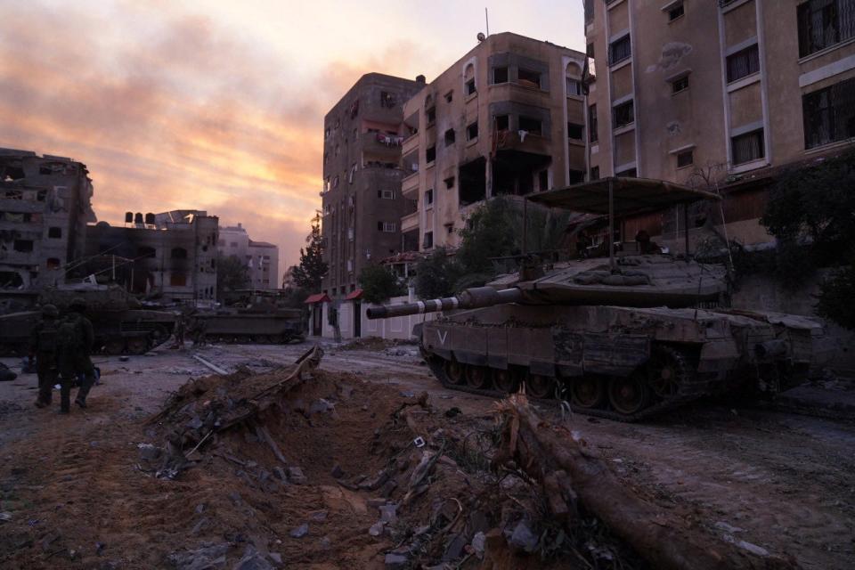 An Israeli soldier looks on from Merkava tank during operations in the Gaza Strip in this handout picture released on Dec. 17, 2023.