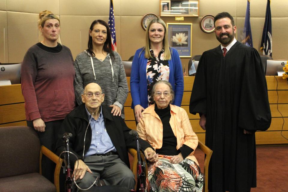 On Monroe County Adoption Day 2022, Monroe County Probate Judge Frank L. Arnold, right, presided over the adoption of Cynthia Skaggs, standing left, Angela Sammons and Samantha Cousino to Donald and Donna Sammons.