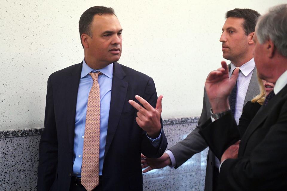 William Burck (from left), Alex Spiro and Jack Goldberger, the defense team for New England Patriots owner Robert Kraft, emerge from a court hearing at the Palm Beach County Courthouse in 2019 on Kraft's prostitution case. Kraft's attorneys were attempting to suppress the public release videos of Kraft in the case.