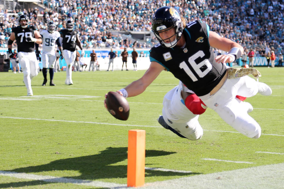 Trevor Lawrence took flight for fantasy football managers in Week 11, accounting for four total touchdowns in a win over the Titans. (Photo by Courtney Culbreath/Getty Images)