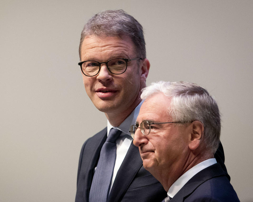 CEO of Deutsche Bank Christian Sewing, left, and head of supervisory board Paul Achleitner are on their way to the annual shareholders meeting in Frankfurt, Germany, Thursday, May 23, 2019. (AP Photo/Michael Probst)