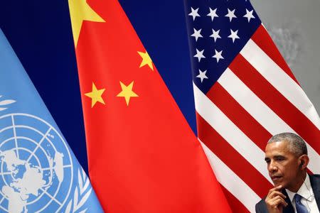 U.S. President Barack Obama listens during a joint ratification of the Paris climate change agreement with Chinese President Xi Jinping (not pictured) ahead of the G20 Summit at the West Lake State Guest House in Hangzhou, China, September 3, 2016. REUTERS/How Hwee Young/Pool