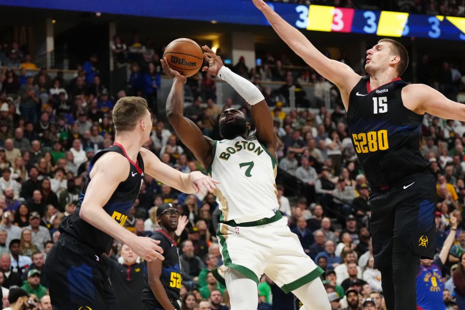 Celtics guard Jaylen Brown shoots against the Nuggets.