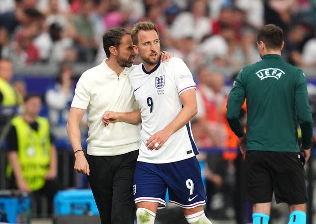 England manager Gareth Southgate puts his arm round Harry Kane as he is substituted during the Euro 2024 match against Denmark