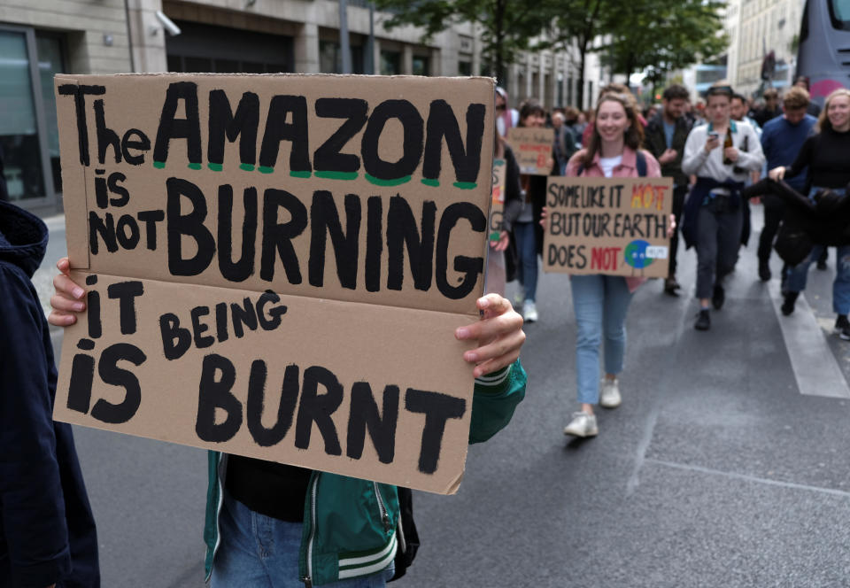 A placard reads "The Amazon is not burning - it is being burnt" during the Global Climate Strike of the movement Fridays for Future in Berlin, Germany, September 20, 2019. (Photo: Wolfgang Rattay/Reuters)