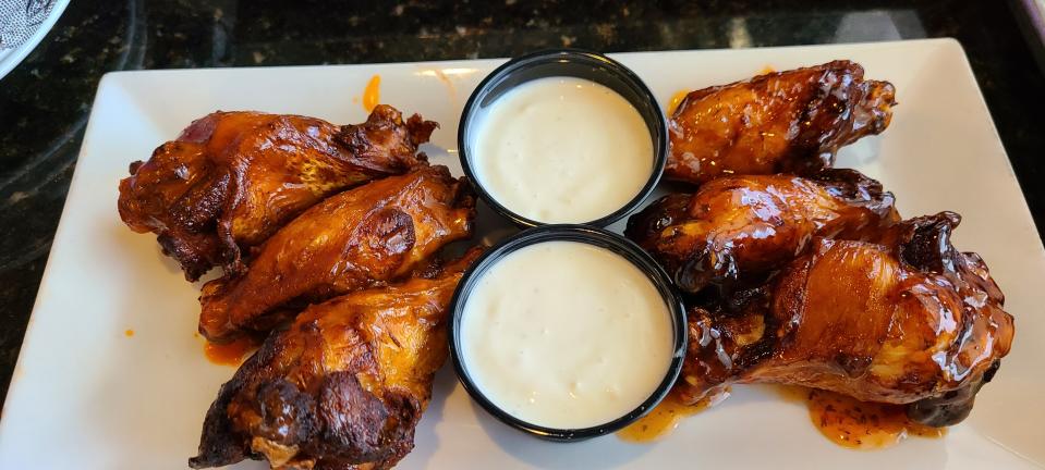 Midnight Tavern's mix and match wings. Mild (L) and Thai chili (R), $11.