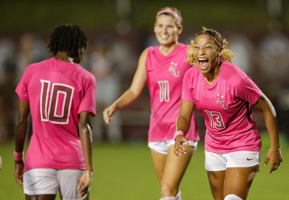 Florida State Seminole LeiLanni Nesbeth (13) celebrates an assist from Seminole Jody Brown (10). The Florida State Seminoles defeat the Syracuse Orange 5-0 Thursday, Oct. 7, 2021.