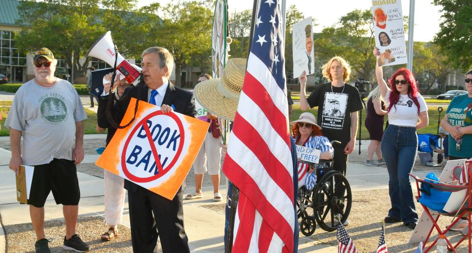 Philip Stasik leads the rally as people gather before the March 7 meeting of the Brevard County school board in Viera. The rally, organized by Awake Brevard Action Alliance, was called ”Don’t Jail Our Schools," and was a protest against numerous actions, including book banning.