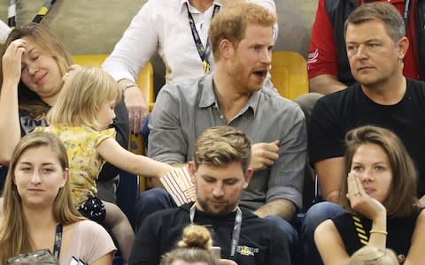 Emily spots her moment when Prince Harry is deep in conversation - Credit: Chris Jackson/Getty