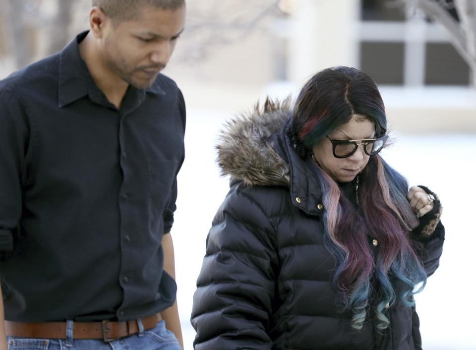 Prince's sister Tyka Nelson, right, arrives at the Carver County Justice Center for a hearing on her brother's estate Thursday, Jan. 12, 2017, in Chaska, Minn. All the siblings want the judge to declare the trust company Comerica as a "personal representative," or executor, of the estate. But they're divided on whether to name anyone as co-executor. Four of the six siblings back longtime Prince lawyer L. Londell McMillan. But Tyka Nelson and Omar Baker object. (David Joles/Star Tribune via AP)