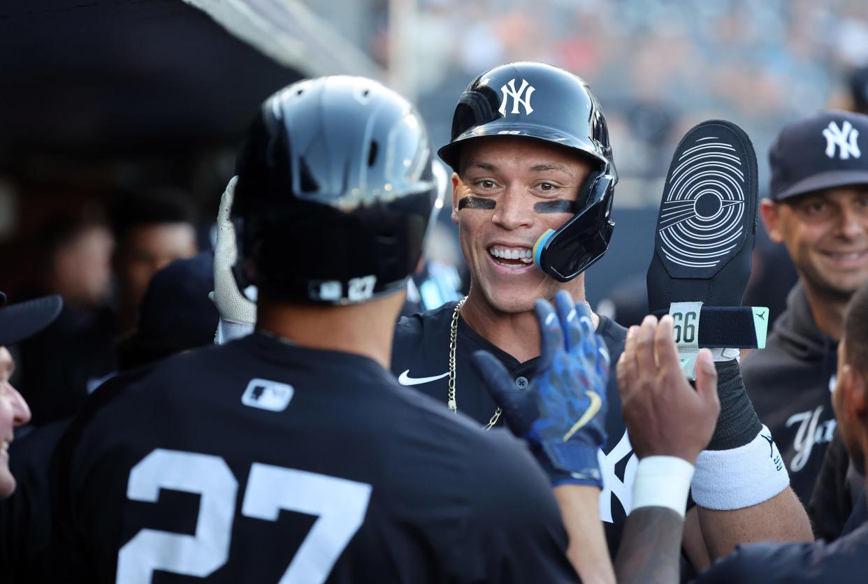 Mar 20, 2024; Tampa, Florida, USA; New York Yankees right fielder Aaron Judge (99) congratulates designated hitter Giancarlo Stanton (27) after he hit a 2-run home run during the first inning against the Pittsburgh Pirates at George M. Steinbrenner Field. Mandatory Credit: Kim Klement Neitzel-USA TODAY Sports