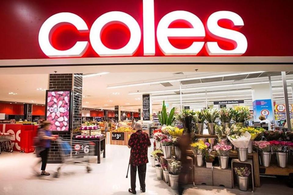 Coles shoppers enter supermarket with trolleys