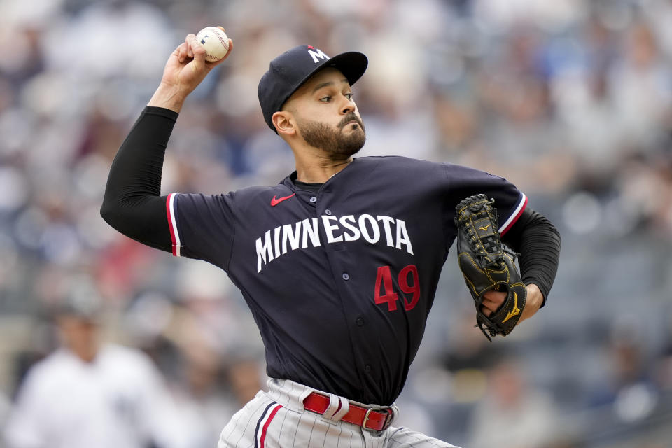 Minnesota Twins starting pitcher Pablo Lopez (49) throws in the first inning of a baseball game against the New York Yankees, Sunday, April 16, 2023, in New York. (AP Photo/John Minchillo)