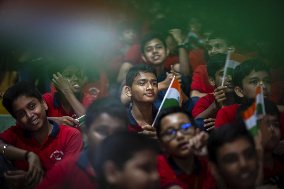 Schoolchildren celebrate the successful landing of spacecraft Chandrayaan-3 on the moon, in a school in Guwahati, India, Wednesday, Aug. 23, 2023. India has landed a spacecraft near the moon's south pole, an unchartered territory that scientists believe could hold vital reserves of frozen water and precious elements, as the country cements its growing prowess in space and technology. (AP Photo/Anupam Nath)