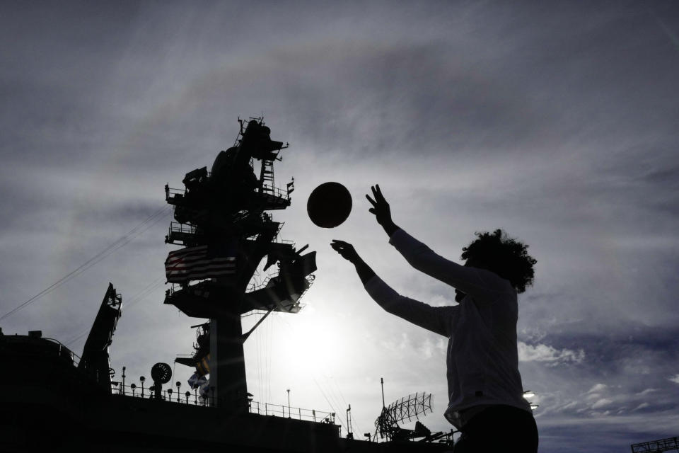 Gonzaga players warm up before the Carrier Classic NCAA college basketball game against Michigan State aboard the USS Abraham Lincoln in Coranado, Friday, Nov. 11, 2022. (AP Photo/Ashley Landis)