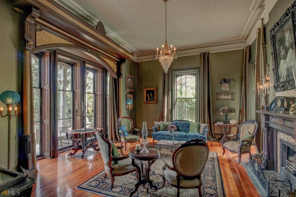 The 140-year-old Victorian home still contains many of its original detailing — including handcrafted built-in bookshelves, cabinetry, moldings, a custom buffet, and more. The home features an antique wall safe and a unique cast iron urinal.