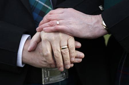 Larry Lamont and Jerry Slater (R) take part in a symbolic same-sex marriage outside the Scottish Parliament in Edinburgh, Scotland February 4, 2014. REUTERS/Russell Cheyne