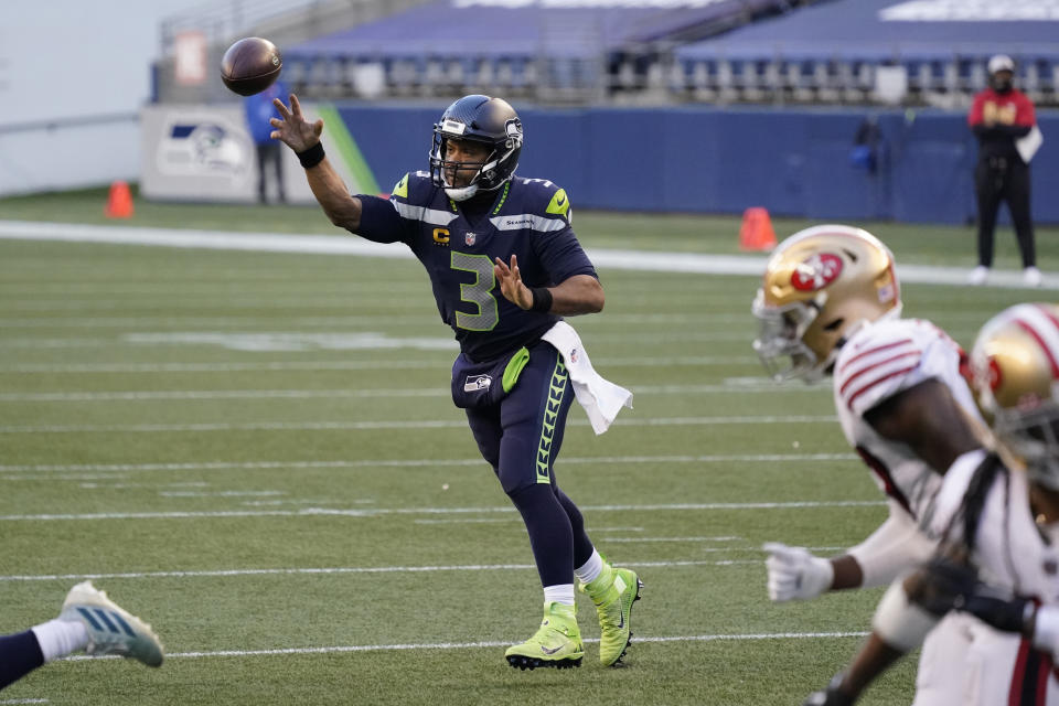 Seattle Seahawks quarterback Russell Wilson passes against the San Francisco 49ers during the second half of an NFL football game, Sunday, Nov. 1, 2020, in Seattle. (AP Photo/Elaine Thompson)