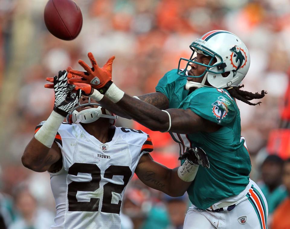 092511 (Allen Eyestone/The Palm Beach Post) CLEVELAND, OH... Miami Dolphins at Cleveland Browns..Miami Dolphins wide receiver Clyde Gates (10) catches a long pass in front of Cleveland Browns defensive back Buster Skrine (22) on the final drive but was ruled out of bounds.