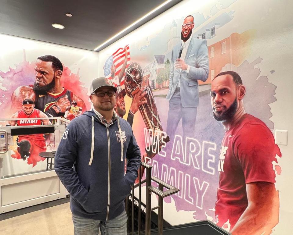 Stark County resident Dirk Rozich is shown at House Three Thirty in Akron where the artwork he created of LeBron James is displayed at the entrance to the new LeBron James' Home Court museum.