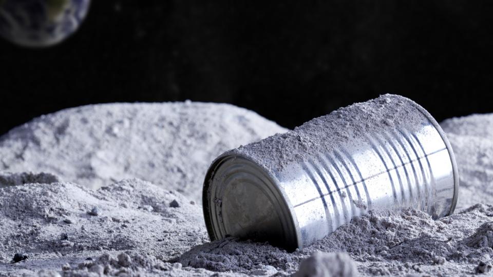  An illustration of a discarded tin can on the surface of the moon. 