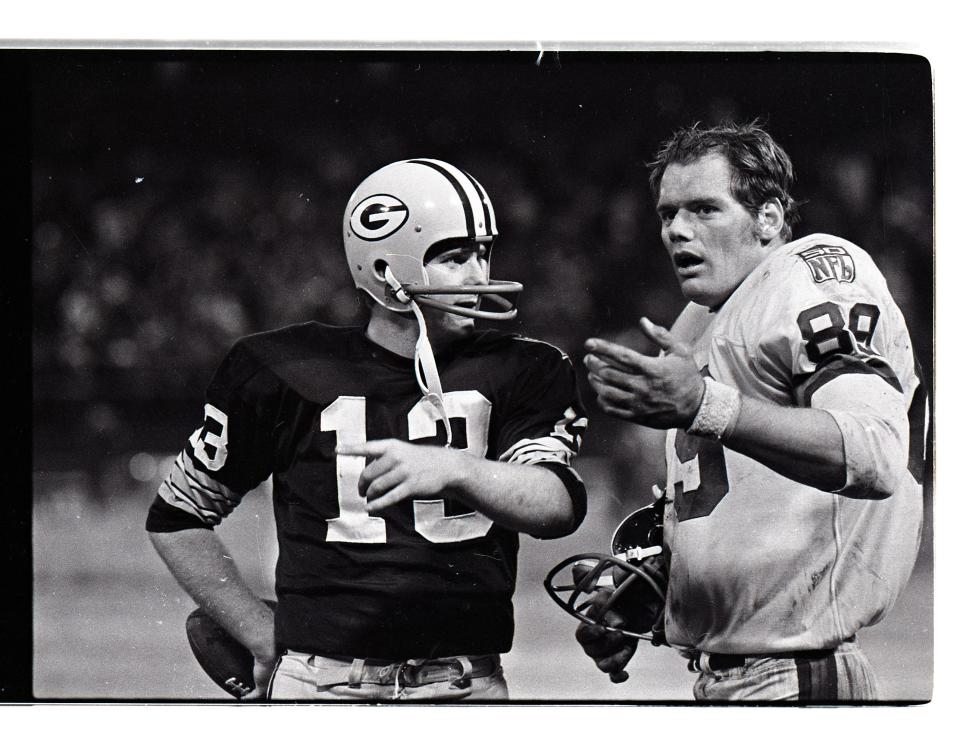 Green Bay Packers quarterback Don Horn talks to New York Giants defensive end Fred Dryer at Milwaukee County Stadium after the Packers 20-10 win on Nov. 30, 1969. They were teammates at San Diego State.