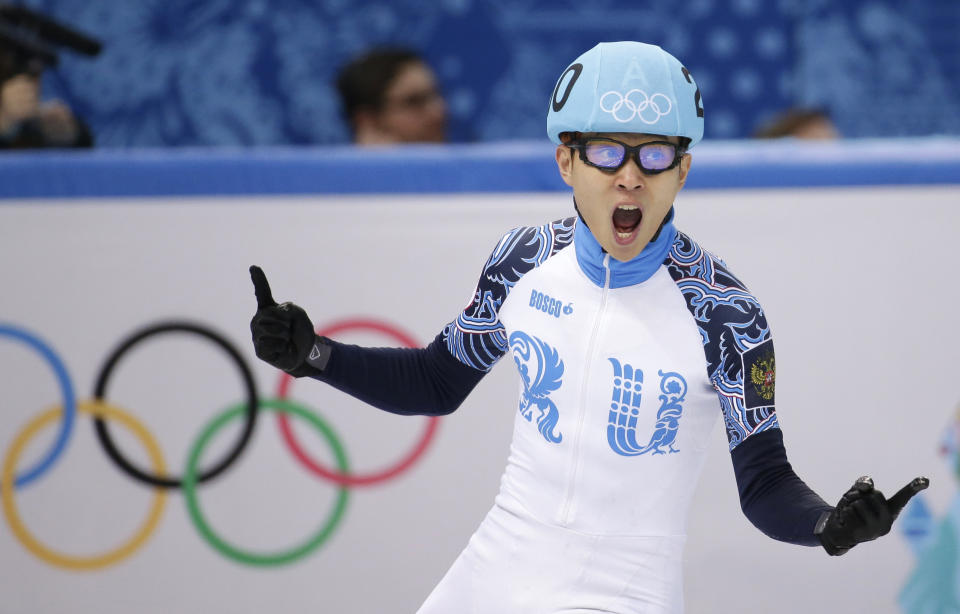 Victor An of Russia celebrates after his first place in the men's 500m short track speedskating final at the Iceberg Skating Palace during the 2014 Winter Olympics, Friday, Feb. 21, 2014, in Sochi, Russia. (AP Photo/Bernat Armangue)