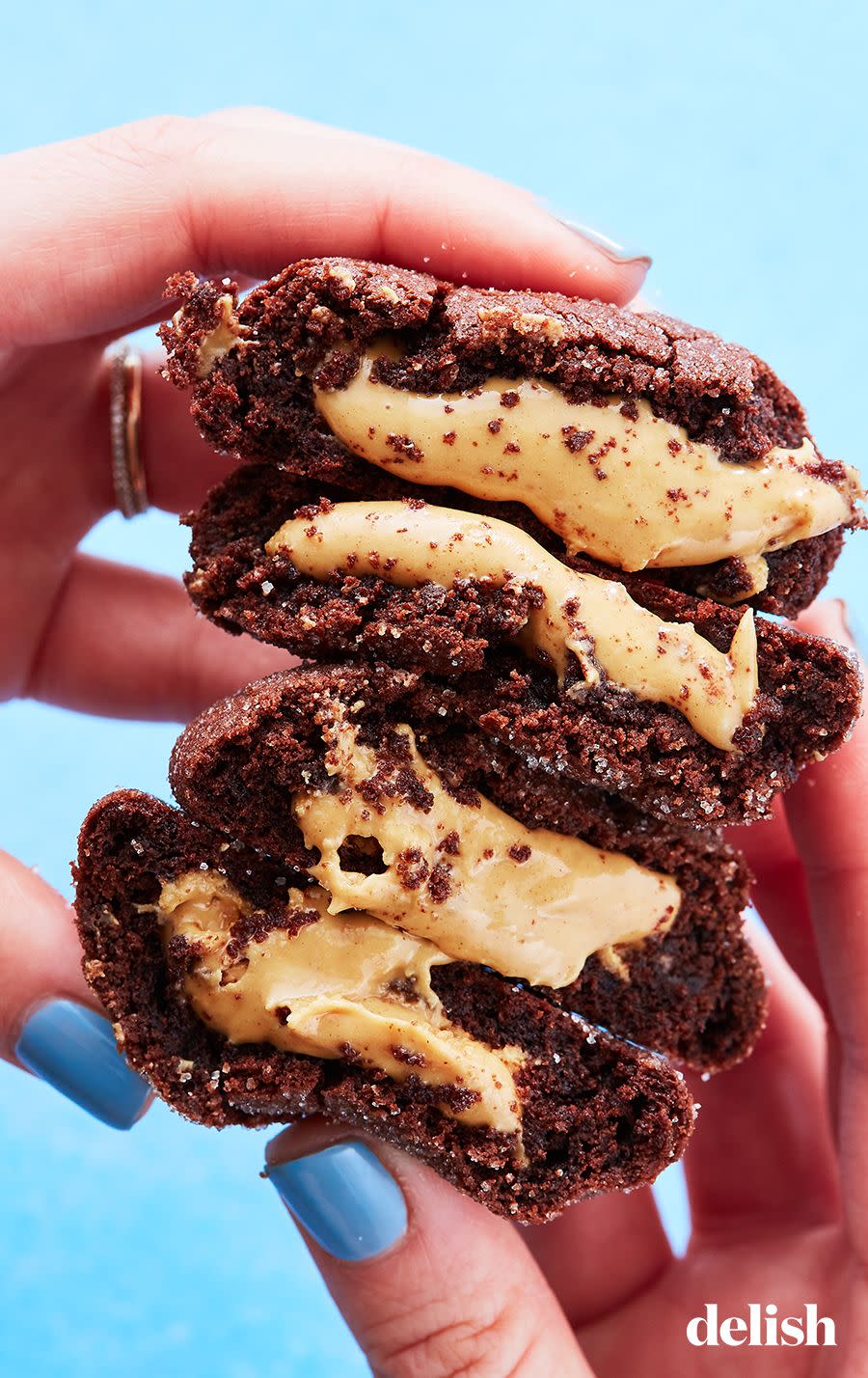 <p>These cookies are truly EXPLODING with peanut butter. What could be better?</p><p>Get the recipe from <a href="https://www.delish.com/cooking/recipe-ideas/recipes/a54052/buckeye-cookies-recipe/" rel="nofollow noopener" target="_blank" data-ylk="slk:Delish;elm:context_link;itc:0;sec:content-canvas" class="link ">Delish</a>.</p>