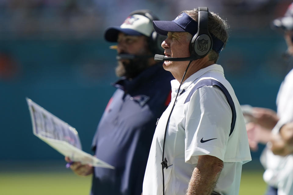 New England Patriots head coach Bill Belichick and Matt Patricia, senior football advisor, watch the game during the second half of an NFL football game against the Miami Dolphins, Sunday, Sept. 11, 2022, in Miami Gardens, Fla. The Dolphins defeated the Patriots 20-7. (AP Photo/Lynne Sladky)