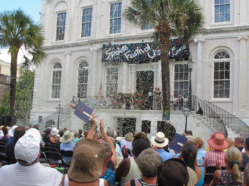 Confetti rains down on the crowd during the opening ceremonies of the Spoleto Festival USA in Charleston, S.C., on Friday, May 25, 2012. The internationally known arts festival was opening its 36th season. (AP Photo/Bruce Smith)