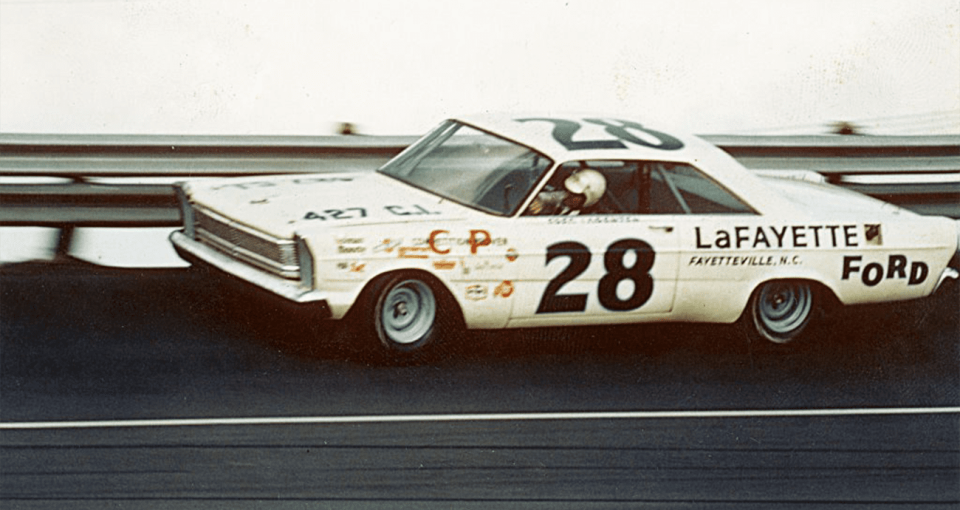 view of old nascar car driving