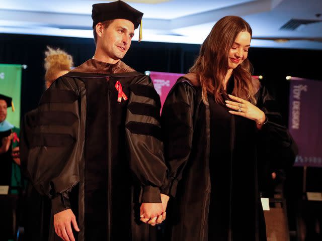 <p>Robert Gauthier/Los Angeles Times/Getty</p> Evan Spiegel and Miranda Kerr receiving honorary Doctorates at the 2022 Otis College of Art and Design commencement ceremonies.