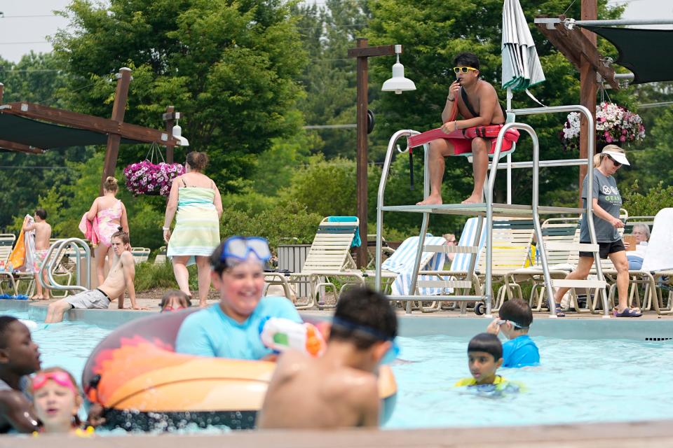 Lifeguard Braden Forbes, 20, monitors kids in the main pool at Highlands Park Aquatic Center in Westerville on June 7.