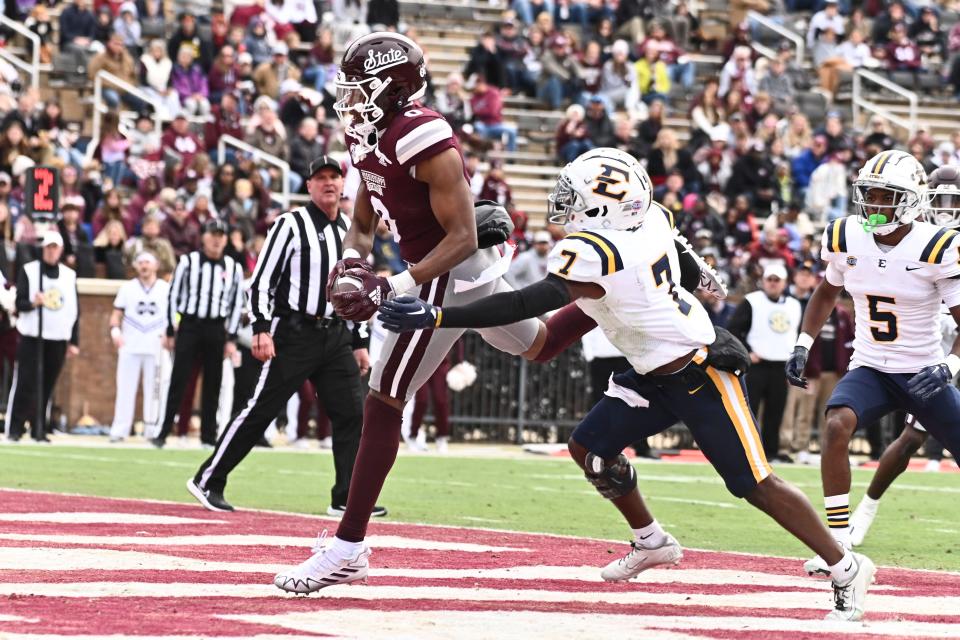 Nov 19, 2022; Starkville, Mississippi, USA; Mississippi State Bulldogs wide receiver Rara Thomas (0) scores a touchdown while defended by East Tennessee State Buccaneers defensive back Quinn Smith (7) during the first quarter at Davis Wade Stadium at Scott Field. Mandatory Credit: Matt Bush-USA TODAY Sports