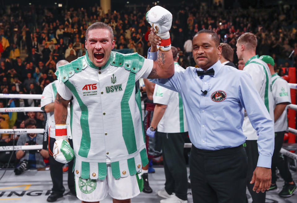 Oleksandr Usyk, left, reacts after defeating Chazz Witherspoon during a heavyweight boxing bout Saturday, Oct. 12, 2019, in Chicago. (AP Photo/Kamil Krzaczynski)