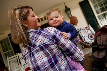 Katy Yeager Gooding holds her baby Kennedy Gooding in Barboursville, West Virginia October 18, 2015. Picture taken October 18, 2015. REUTERS/Jonathan Ernst