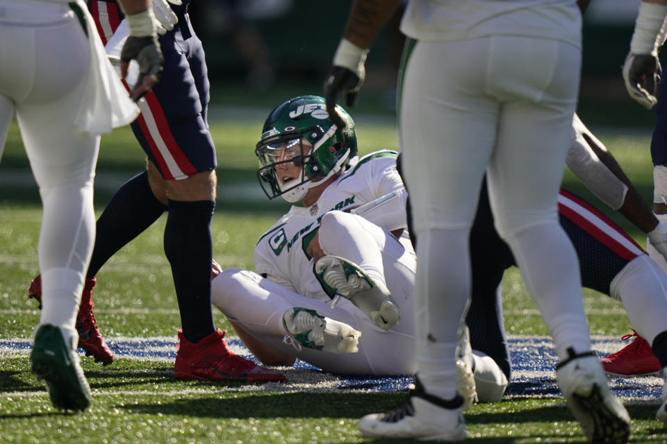 New York Jets quarterback Zach Wilson gets up after being sacked during the second half of an NFL football game against the New England Patriots, Sunday, Sept. 19, 2021, in East Rutherford, N.J. (AP Photo/Frank Franklin II)