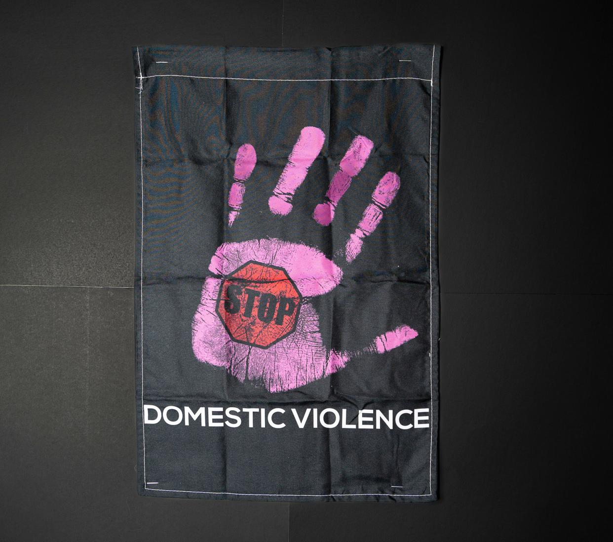 Signs raise awareness on domestic violence at the Love Without Violence conference hosted by the Milwaukee Office of Community Wellness and Safety.