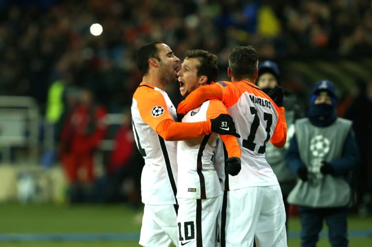 Shakhtar Donetsk's midfielder Bernard (C) celebrates with his teammates after scoring against Manchester City on December 6, 2017