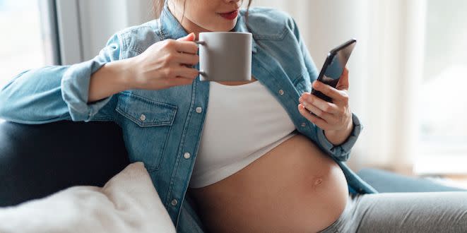 pregnant woman drinking coffee