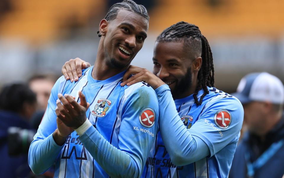 Kasey Palmer (R) celebrates Coventry's win with Haji Wright