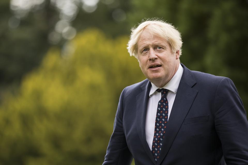 Prime Minister Boris Johnson met police officers during his visit on Wednesday (James Glossop/The Times/PA) (PA Wire)