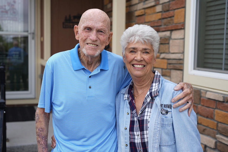 Tom McAdam and his wife, Beverly, stand outside their home Friday, May 31, 2024, in Broomfield, Colo. The retired couple's home in the northwest Denver suburb has risen 45 percent in value since purchasing six years ago that has increased their property tax. The couple is backing a Colorado ballot proposal that could cap the growth of property tax revenue, one of several measures in states this year to limit, cut or offset escalating property taxes in response to the complaints of residents. (AP Photo/David Zalubowski)