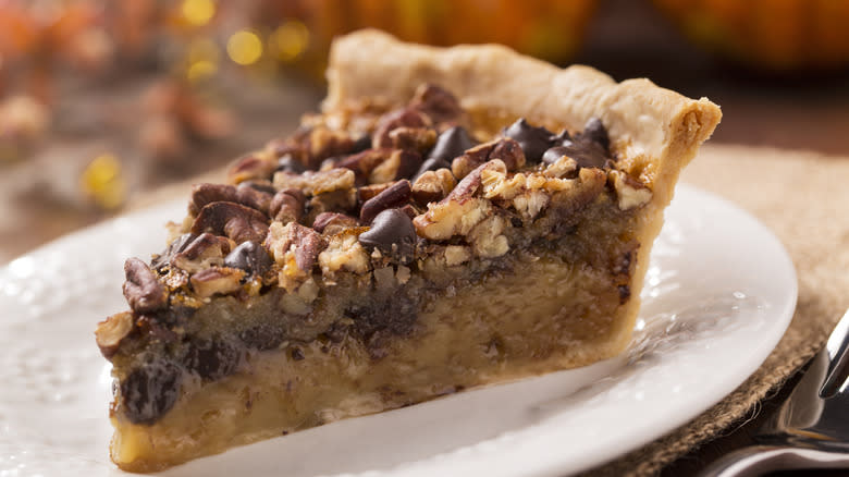 Chocolate pecan pie on plate